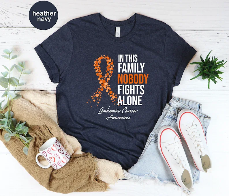 Camiseta Unisex para la concientización sobre el cáncer de la gripe, en esta familia, nadie lucha solo, regalo del escuadrón de apoyo, mes de concientización