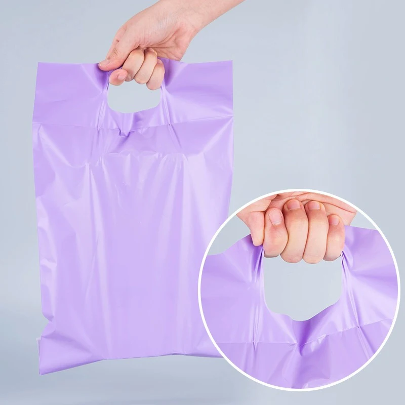 TETP-bolsas de mensajería púrpuras de 100 piezas, ropa con asa blanca, tarjeta de regalo, peluca, embalaje de envío, impermeable, grueso, venta al por mayor