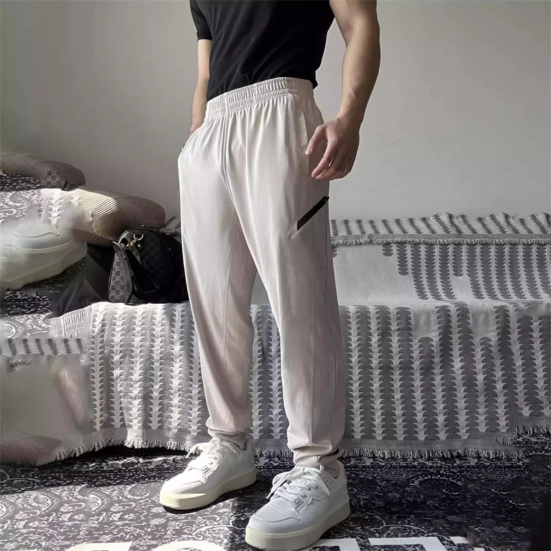 

spring autumn Breathable Loose thin Running Pants Men Sport Training Sportswear Elastic Waterproof Outdoor Zip Pocket Sweatpants