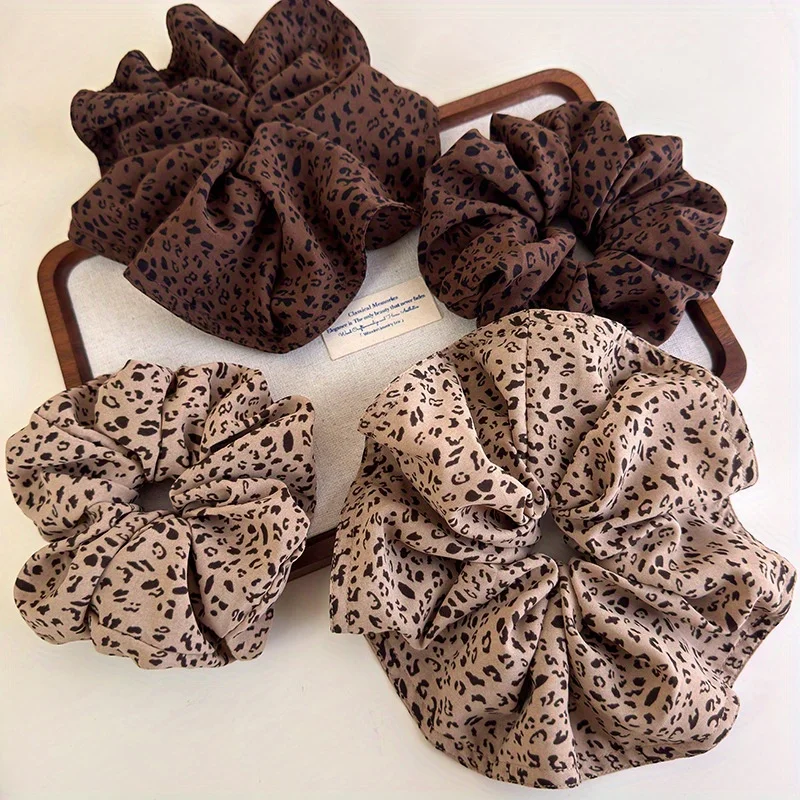 Combo de accesorios para el cabello con estampado de leopardo: lazo grande para el cabello, cuerda de cola de caballo baja, conjunto de diadema elegante para niñas de principios de otoño