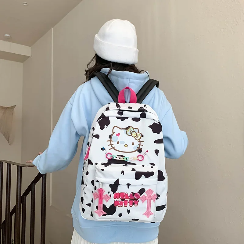 

Sanrio Hello Kitty Sweet and cute student schoolbag Cartoon printing Simple contrasting color Large capacity backpack