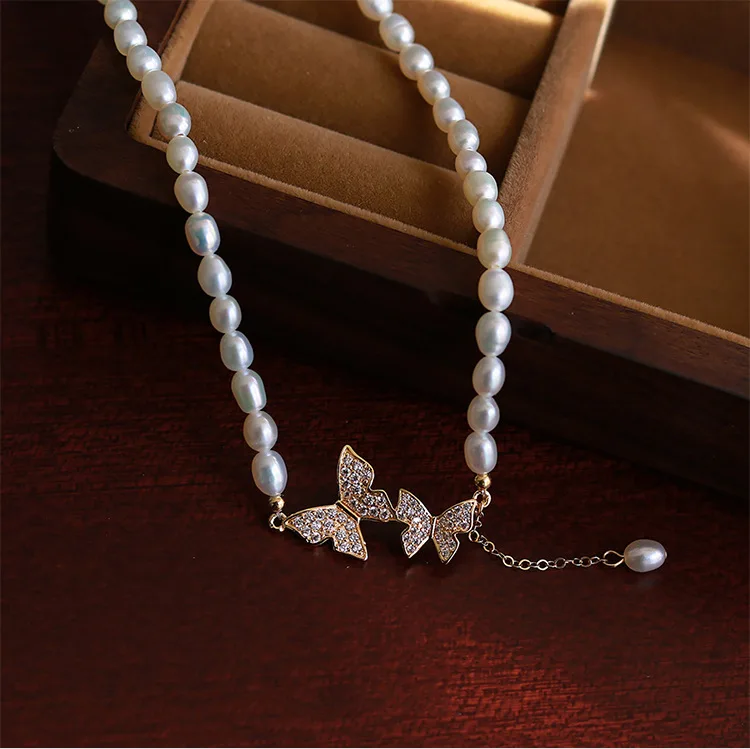 YWYC 6-7mm Rice Shape Freshwater Pearl Necklaces for Women 40cm+4cm Shine Zircon Butterfly Buckle Pearl Necklaces Jewelry Gift