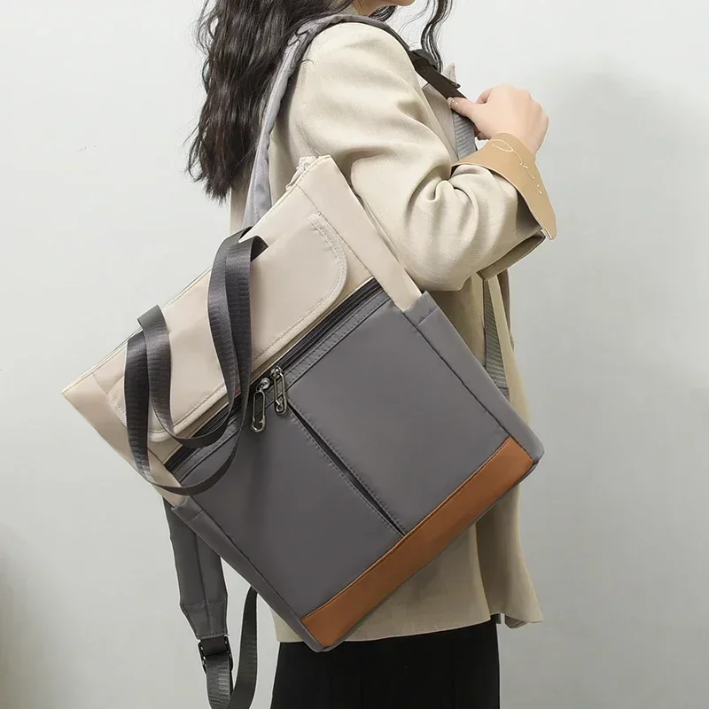 Mochila impermeável de nylon feminina, versátil mochila de viagem, minimalista e elegante, grande capacidade básica, lazer, 2024
