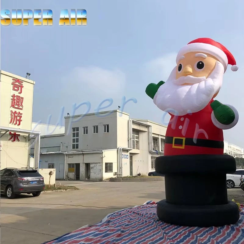 Decoración de celebración navideña al aire libre enorme inflable Santa Claus onda mano