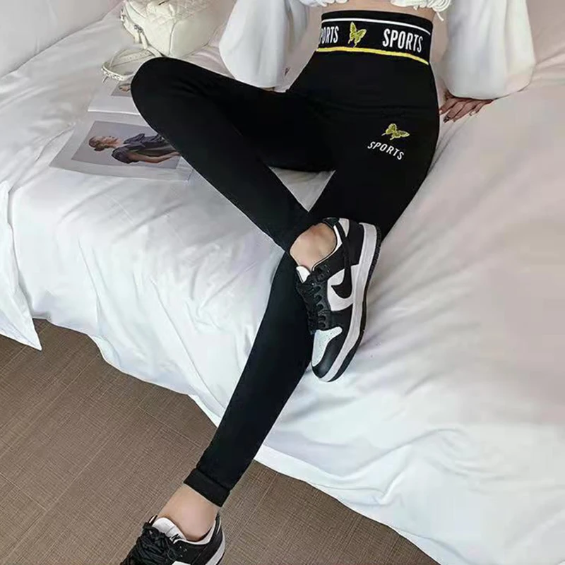 Streetwear wysokie Spandex damskie seksowne Slim, czarny z nadrukiem litery Empire Fashion sportowe spodnie do jogi dziewczęce obcisłe spodnie Fitness