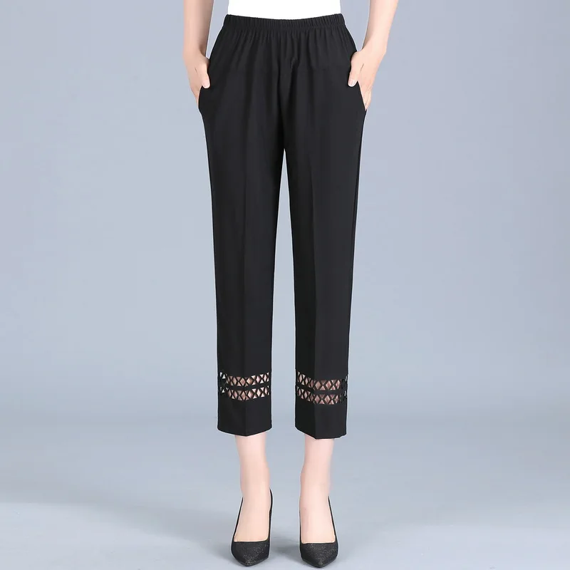 

Летние тонкие свободные брюки для женщин среднего возраста и мам, повседневные брюки длиной 7/9, модный дизайн с вырезами.