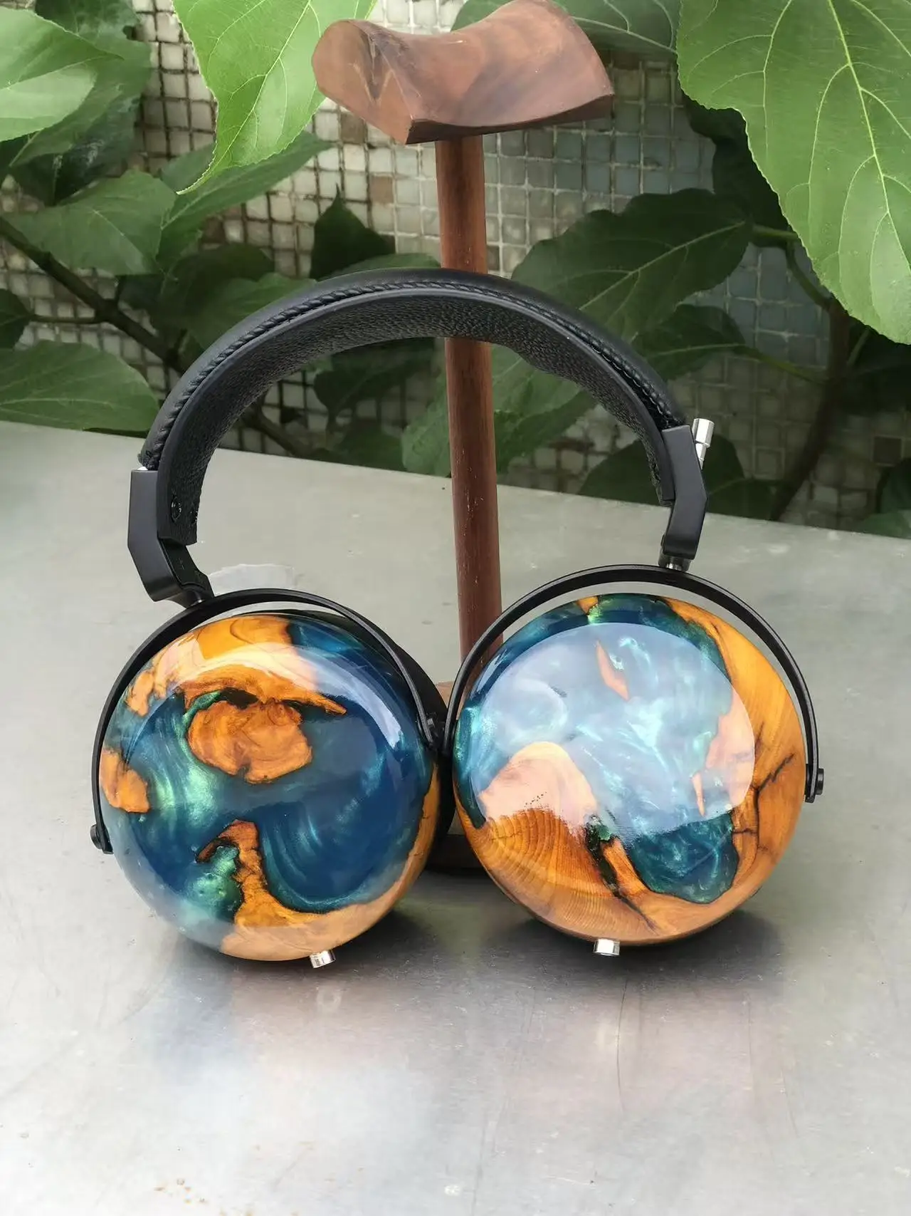 Closed-back headphones with solid wood construction, each piece featuring unique, vibrant, and beautiful grain patterns of high