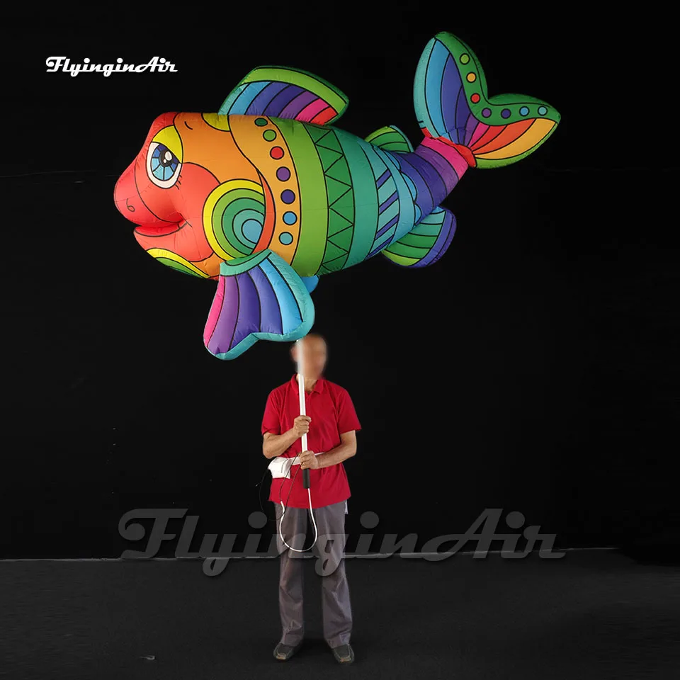 

Fantastic Parade Performance Colorful Inflatable Fish Puppet Holding Blow Up Sea Animal Balloon For Event