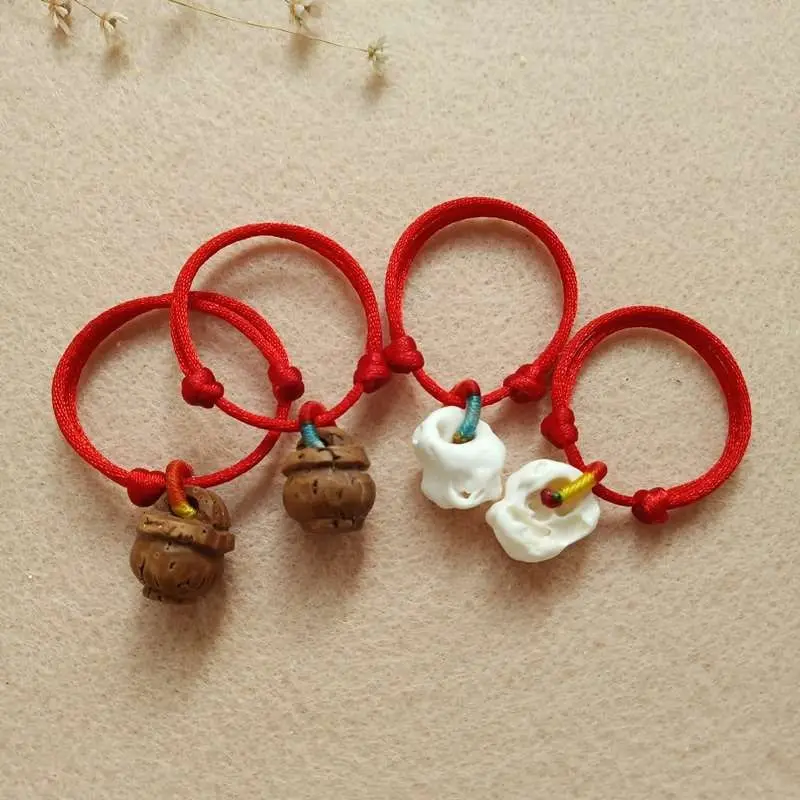 pulseira-ajustavel-vermelha-de-corda-para-bebes-e-criancas-pequenas-feita-a-mao-com-cesto-de-madeira-de-pessegueiro-e-corda