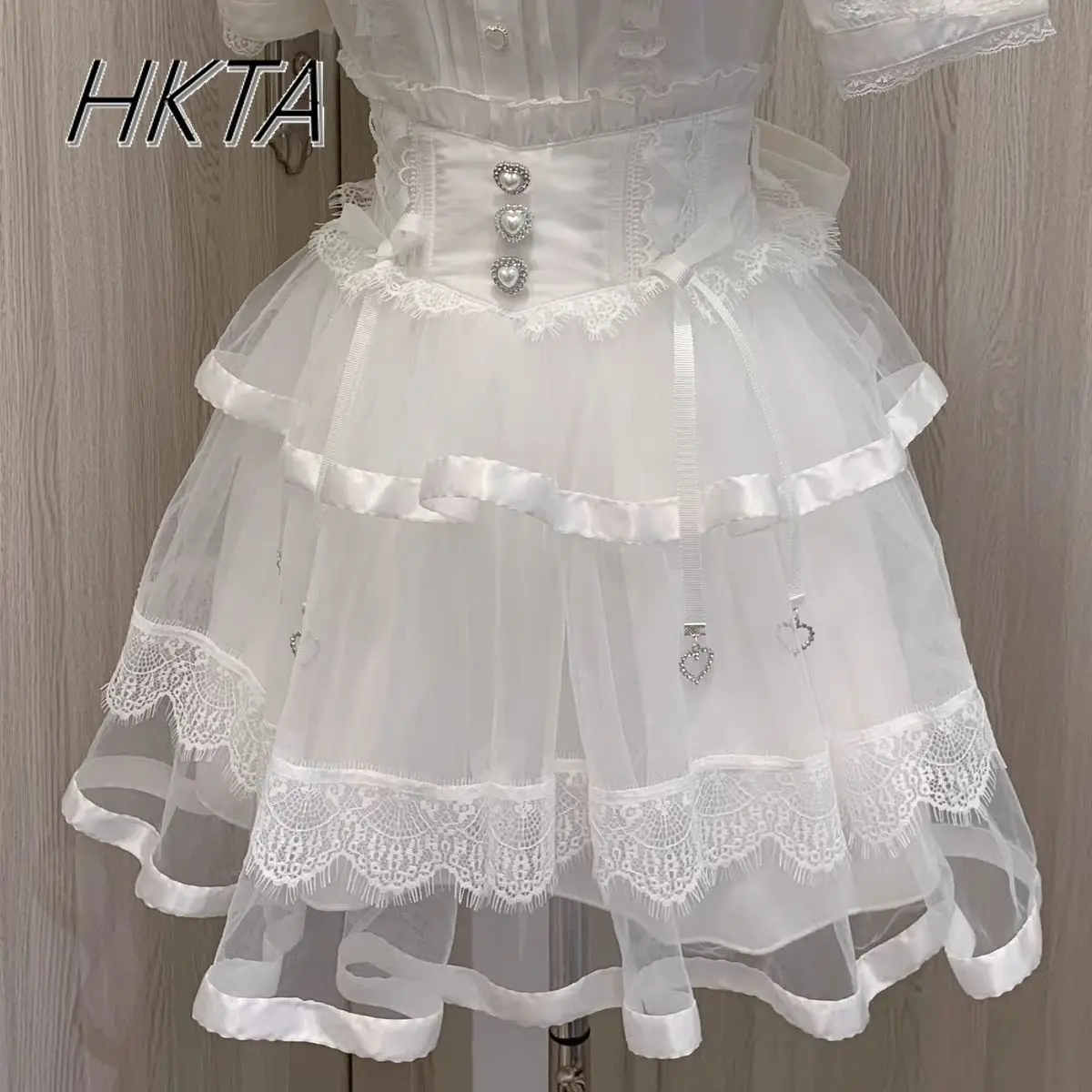 Falda de malla de encaje de cintura alta oscura con lazo de mina japonesa, faldas cortas finas de producción en masa de mina de verano, Falda plisada para mujer 2025