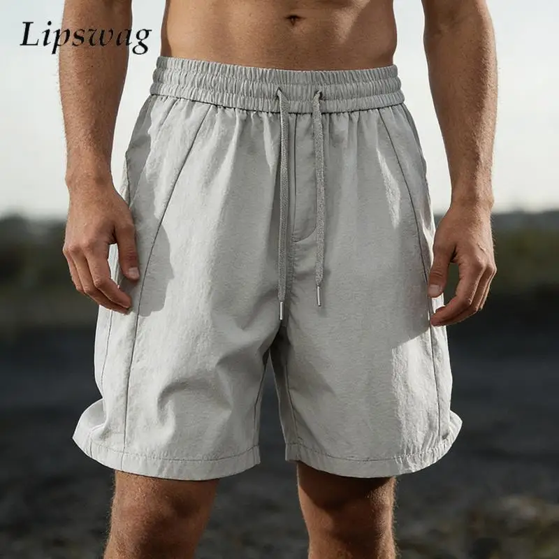 

2026 Summer Stylish Solid Color Bottoms Men Daily Casual Drawstring Loose Straight Shorts Mens Vacation Fashionable Baggy Shorts