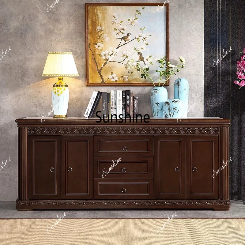 Chinese-style solid wood storage cabinet integrated against the wall for living room and bedroom storage at the foot of the bed