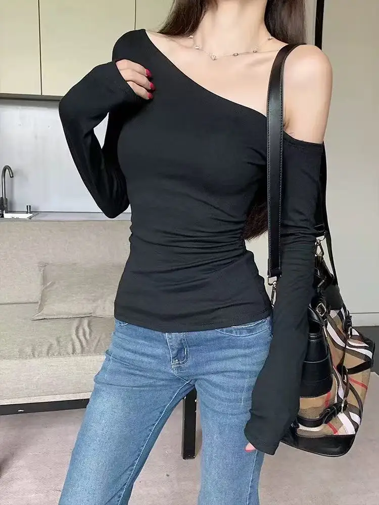 NUOMICI أسود خارج الكتف طويلة الأكمام تريكو تي شيرت للنساء ملابس الخريف سليم صالح مثير انحراف الكتف القمم