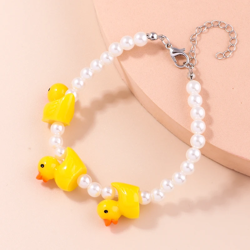 Niedliche handgemachte Imitationsperlen-Armbänder für Frauen, Cartoon-gelbe Ente, Charms-Armbänder, Schmuck, DIY-Geburtstagsparty-Geschenke – Detail 4
