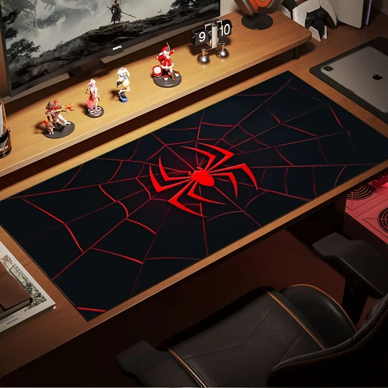 A Large Gaming Mouse Pad Featuring a Red And Black Spider Web Design with a Spider Hero Logo. It Is Non-Slip, Durable
