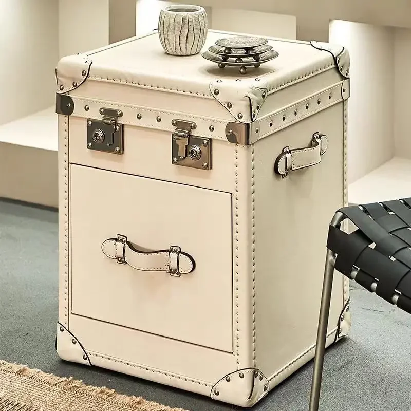 A bedside table, a few cabinets on the edge of the leather box, a few retro leather edges, living room storage, bedside table
