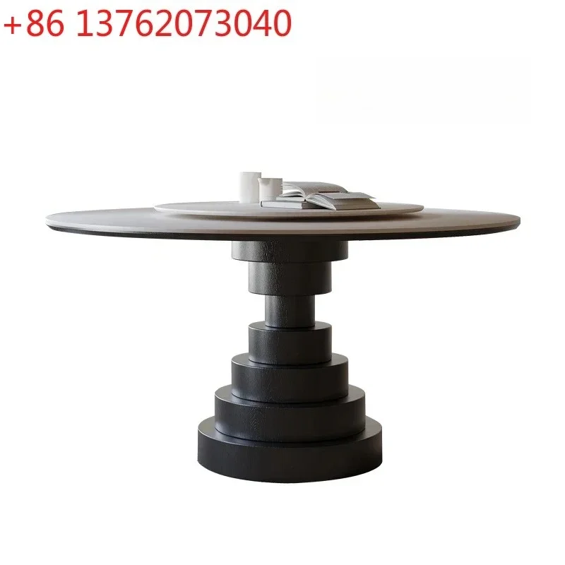 

Винтажный круглый обеденный стол из массива черного дерева в итальянском минималистичном стиле, с поверхностью из травертина, имитирующей песчаную породу.