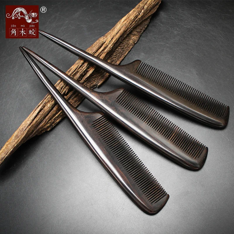 Ebony black sandalwood comb with fine teeth and a pointed tail for hair styling