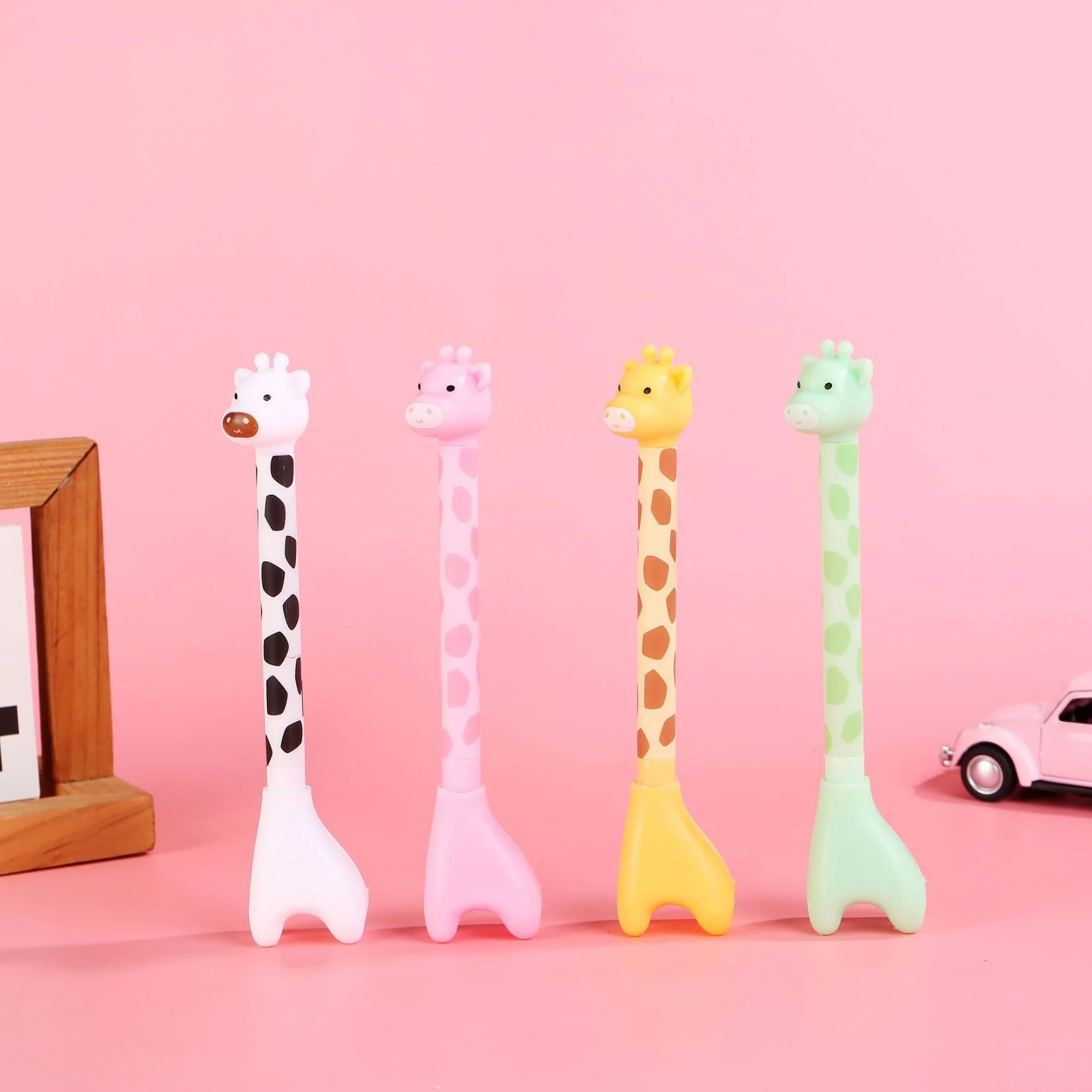Two Cute Giraffe Stationery Pens, with Random Colors. The Black Ink Core Writes Smoothly.