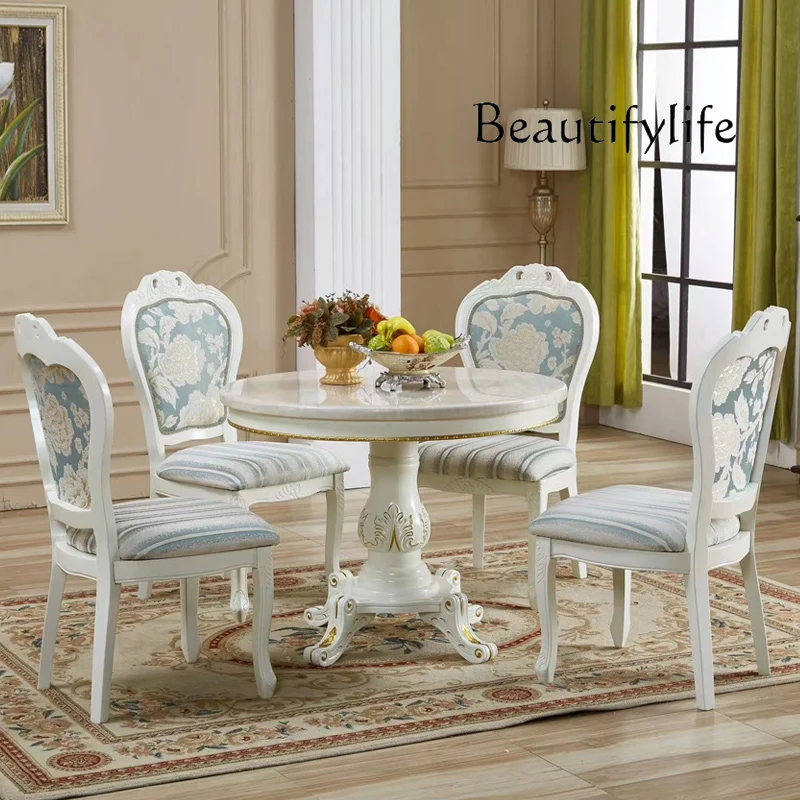 

High-end European dining table and chairs Modern marble small apartment carved solid wood home meal round table designer
