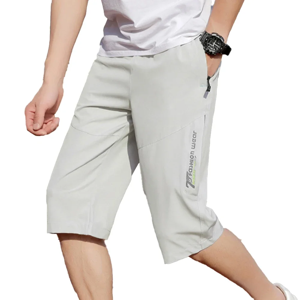 

Мужские однотонные брюки длиной до икры с эластичной резинкой на талии, прямые брюки с карманами на молнии