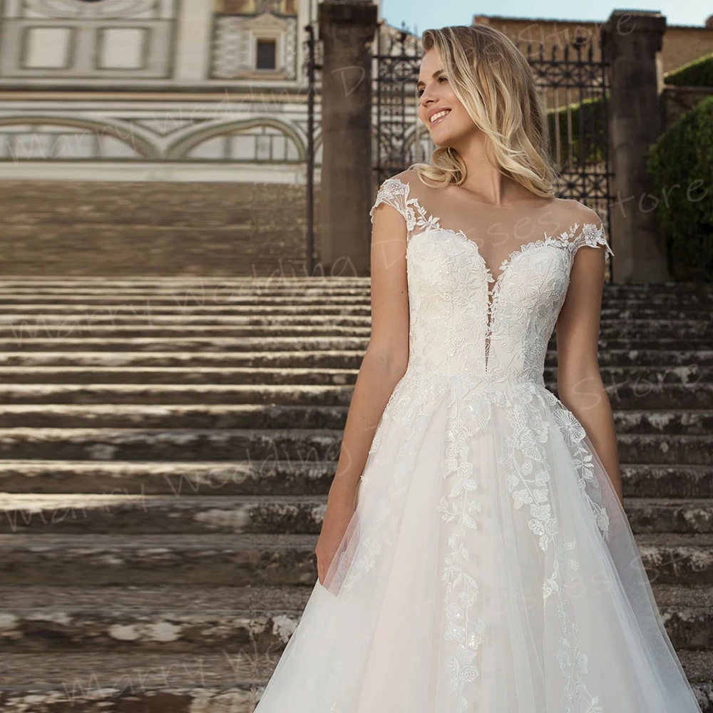 Grazioso O collo una linea abiti da sposa da donna graziose Appliques abiti da sposa in pizzo affascinante bottone con maniche A berretto Vestidos De Novia