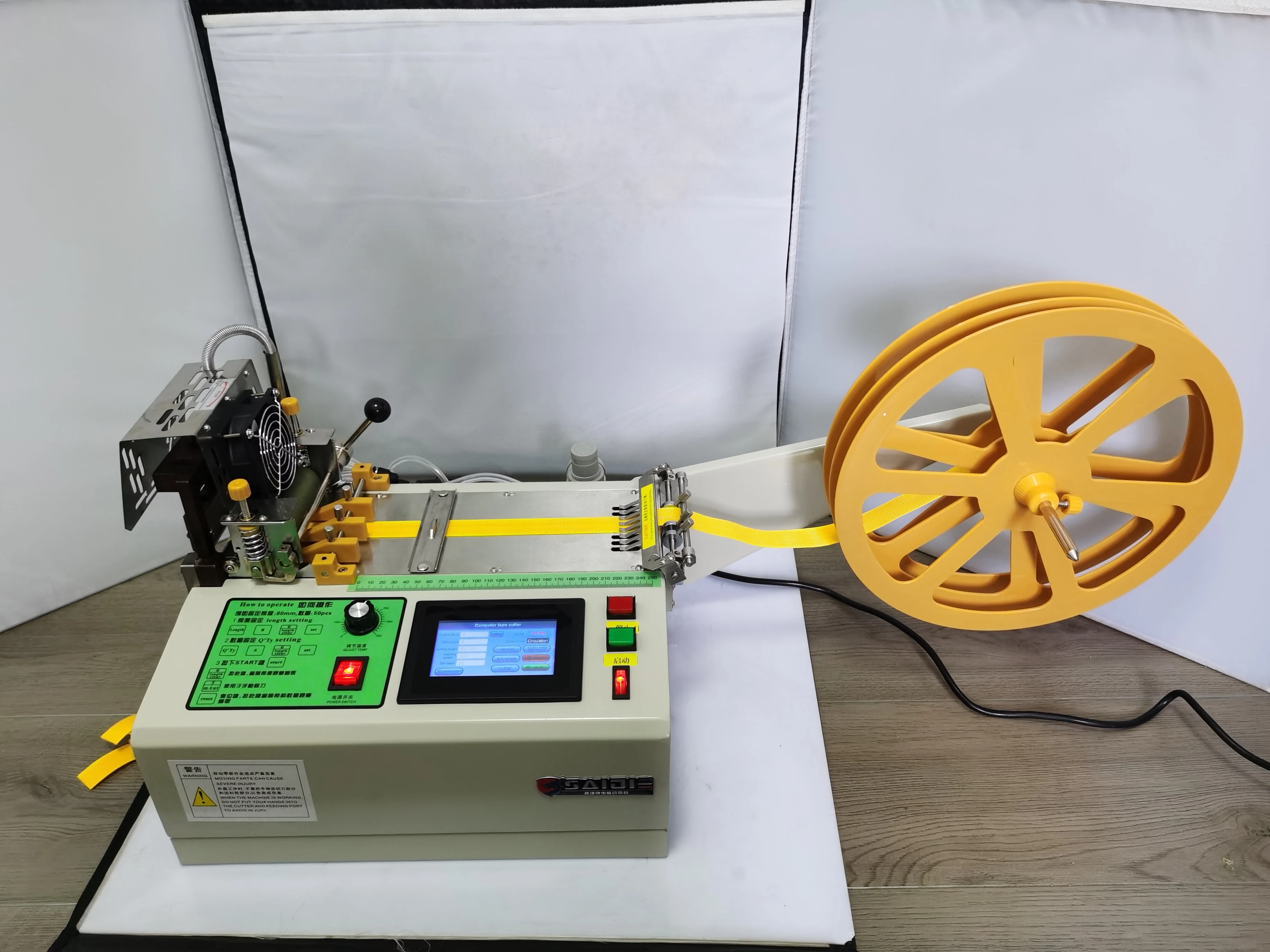 

touch screen version automatic Cloth belt hot cutting machine,987T ribbon Nylon webbing elastic belt cutting pneumatic clip belt