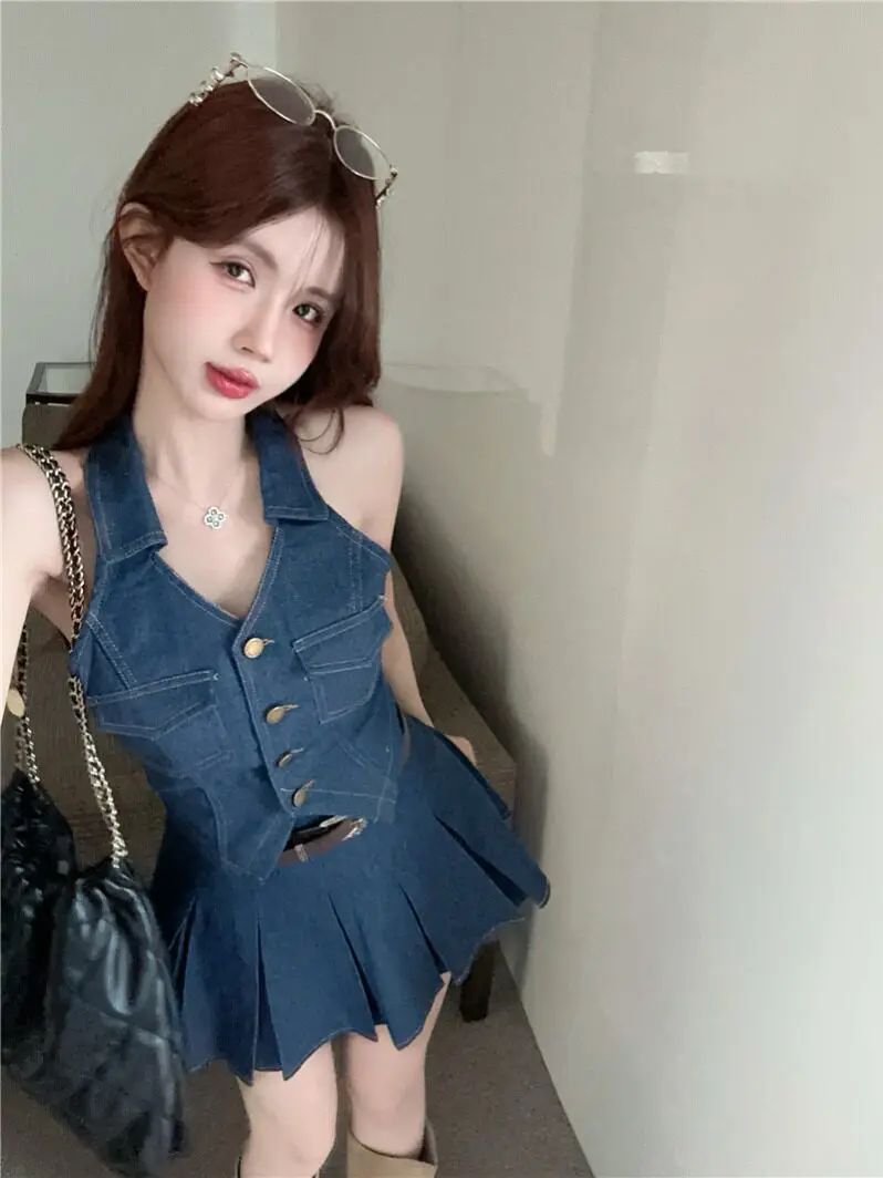 

Сексуальный шикарный джинсовый комплект: юбка и жилет, женский модный костюм для ранней весны, топ и брюки, двухсоставный комплект, V-образный вырез, на пуговицах, повседневная одежда