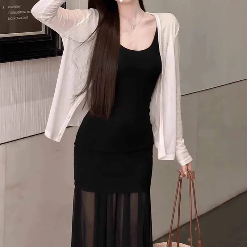 Nouvelle robe longue sexy noire pour femme, à fines bretelles, en maille transparente, coupe ajustée, idéale pour les soirées, collection 2026