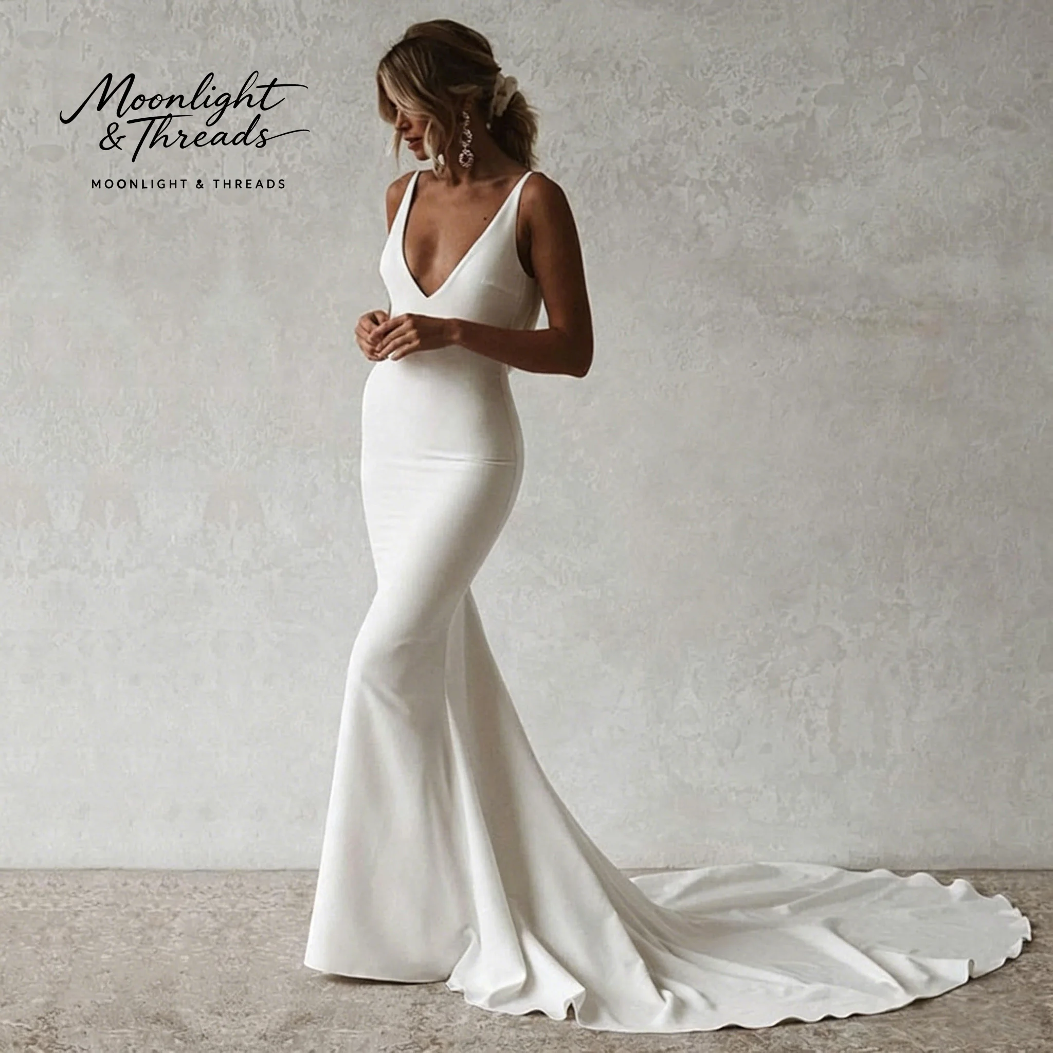 

Exquisite white satin V-neck open-back floor-length mermaid gown for weddings and formal occasions