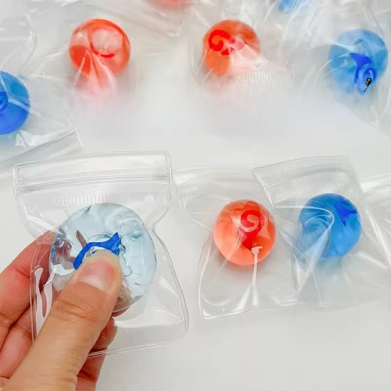 2 Stück neue Squishy Tabas Stressball Cartoon Animation Clear Mini TPR Soft Sticky Bag Ball Squeeze Fidget Kinderspielzeug Urlaubsgeschenke