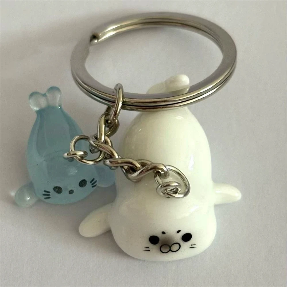 لطيف الأبيض ثلاثية الأبعاد مضيئة أسد البحر المفاتيح مفتاح للنساء تصميم بسيط الحيوان كيرينغ الفتيات الصغيرات حقيبة قلادة مفتاح مجوهرات N949