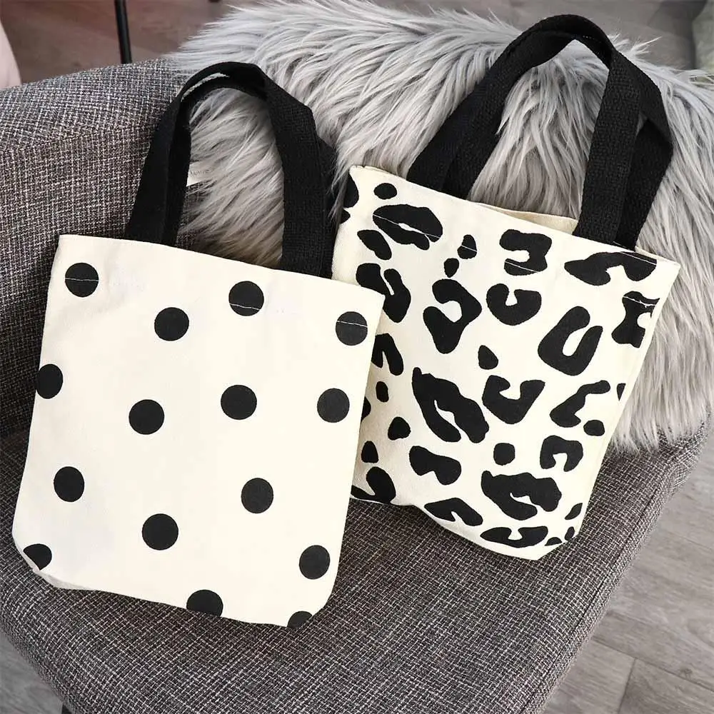 กระเป๋าใส่อาหารกลางวัน กระเป๋าสะพายสำหรับพนักงานออฟฟิศ ลายเสือดาว สำหรับนักเรียน ช้อปปิ้ง ใส่หนังสือ กระเป๋าผ้าแคนวาสสไตล์เกาหลี กระเป๋าสะพายไหล่ผู้หญิง กระเป๋านักเรียน