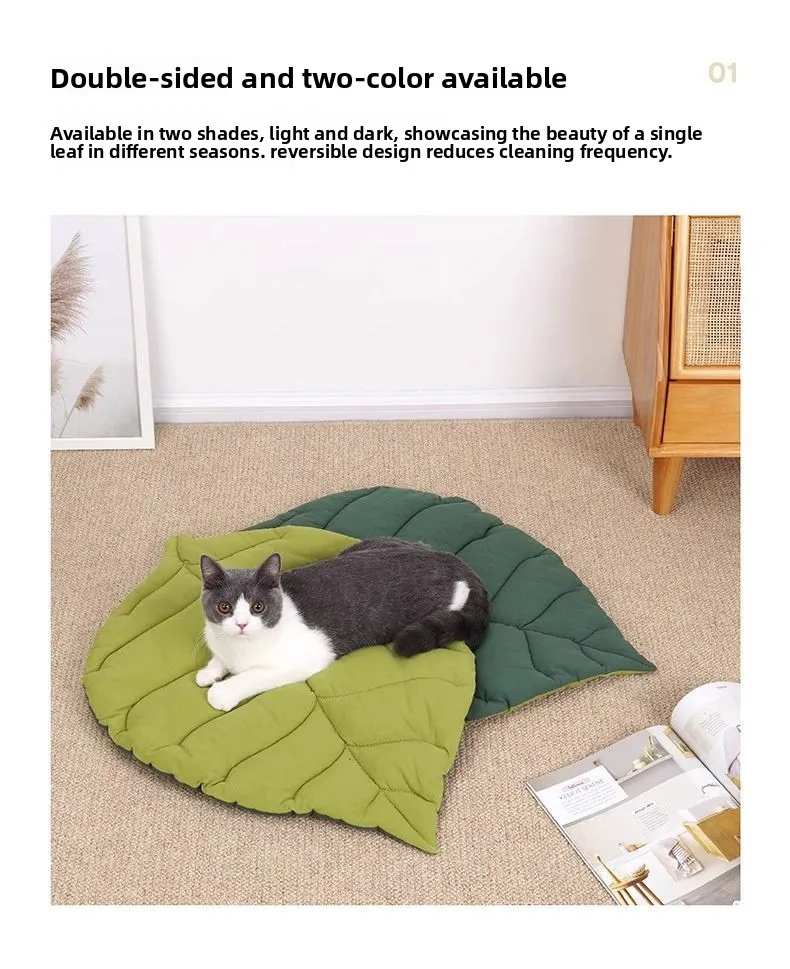A grey and white cat lying on a grey and white leaf-shaped Leaf Pattern Cat Sleeping Mat.