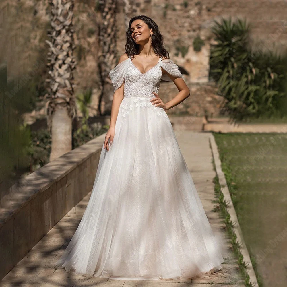 Eleganti abiti da sposa da donna con scollo a V abiti da sposa senza schienale in Tulle luminoso nuovo con spalle scoperte a-line Mopping Length Vestidos De Novia