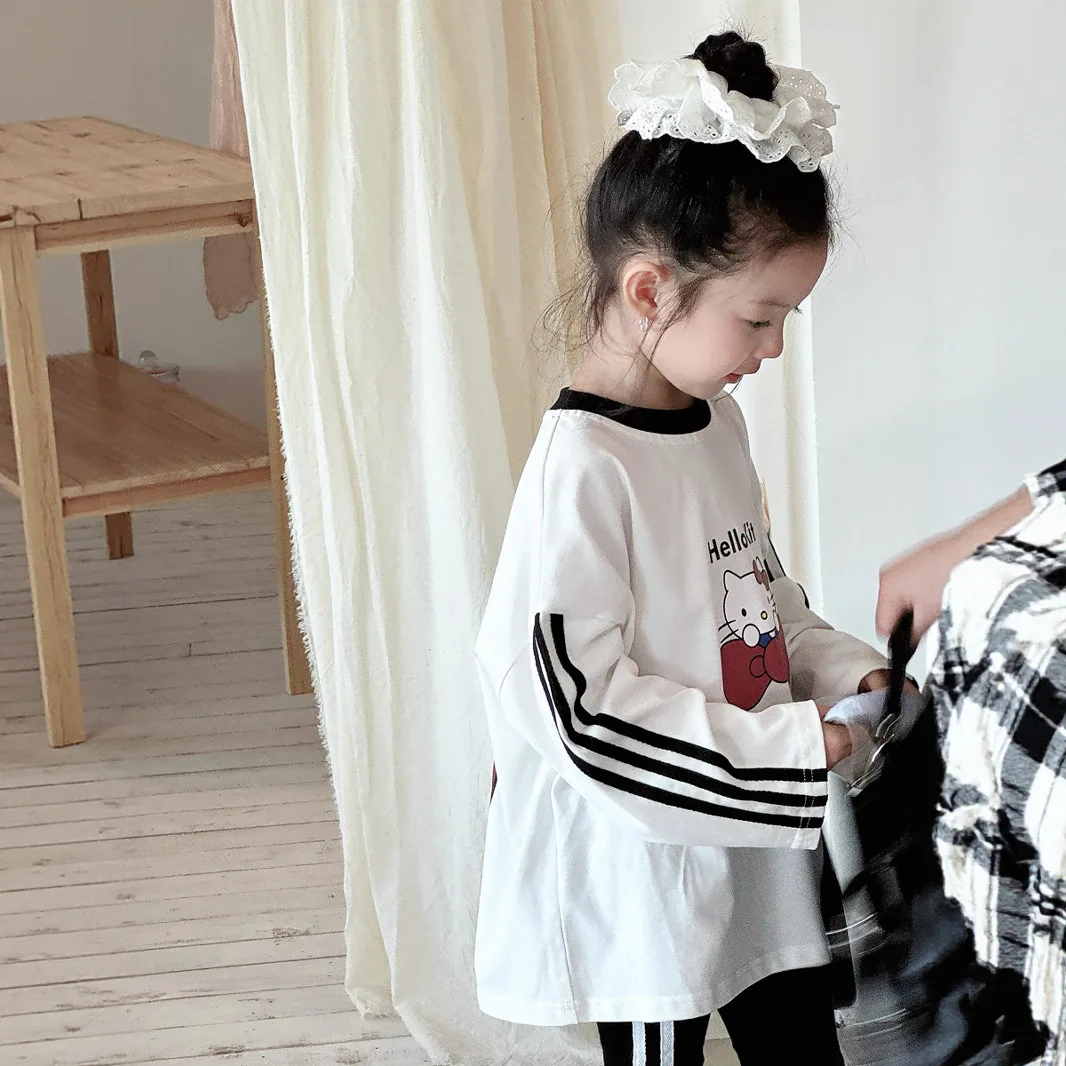أنيمي HelloKitty الفتيات النسخة الكورية الخريف تي شيرت القوس القط مطبوعة بأكمام طويلة تي شيرت الأطفال ثلاثة بار فضفاض رداء علوي غير رسمي