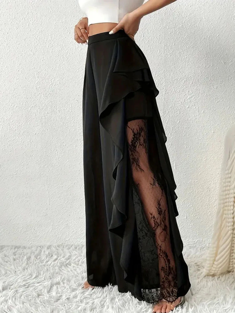 Pantaloni alla moda e cadenti in rete di pizzo irregolare a fessura a vita alta