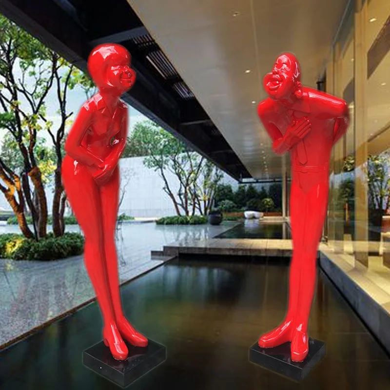 Bow at the entrance of the hotel FRP welcome figure sculpture men and women welcome floor ornament red festive bow