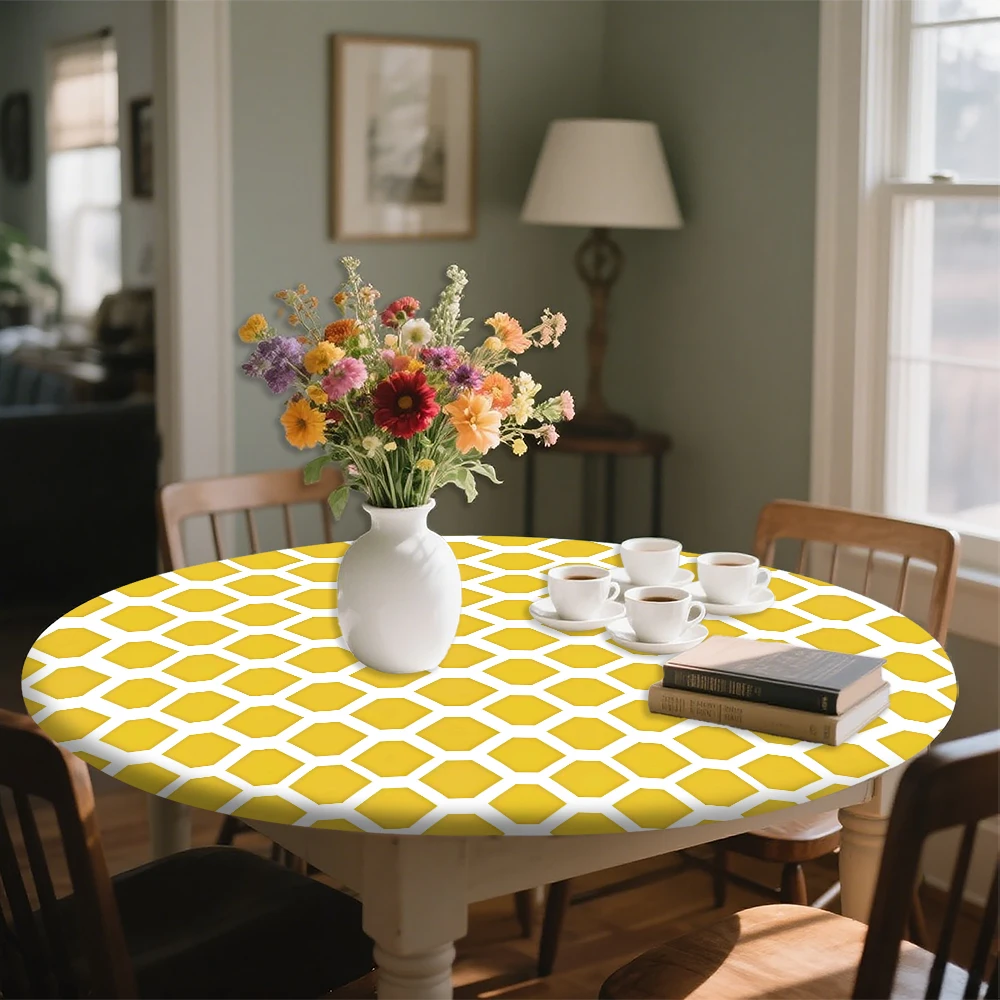 The round elastic tablecloth features a yellow and white hexagonal pattern. Made of polyester, it's suitable for indoor dining r