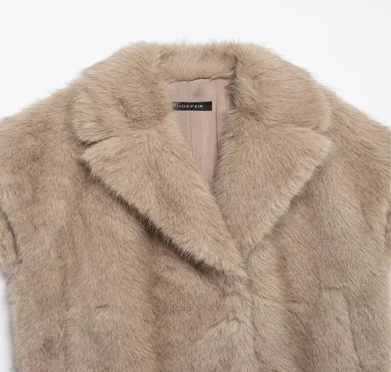 

Новый зимний женский жилет с эффектом синтетического меха, универсальный дизайн, для поездок на работу, длина, один пуговиц, чистый цвет