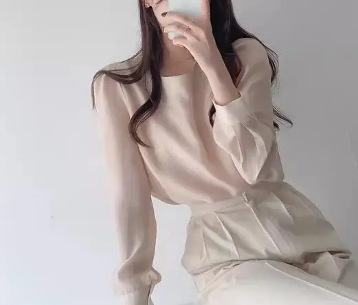 

2026 Early Spring Fashion Simple Round Neck Mesh Slightly Transparent One Button Hollow Out Long Sleeved Bottom Shirt Top Women