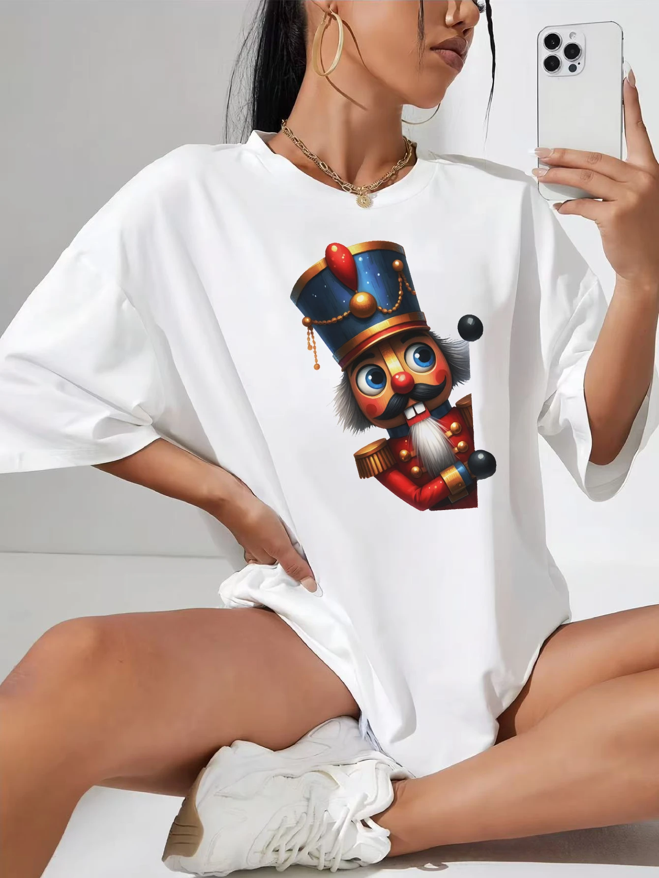 

Christmas Characters peeking around Winter-Ready White Cotton T-Shirt for Women Christmas Casual Wear Plus Maternity Friendly