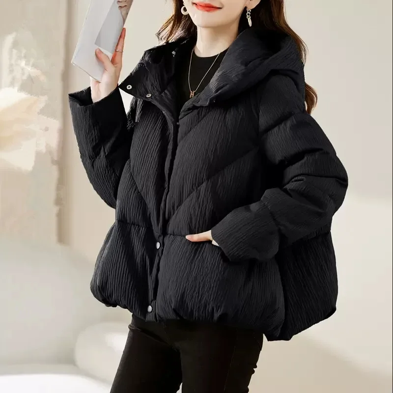 Piumino in cotone leggero con cappuccio Parka coreano da donna con cerniera invernale 2025 Nuovo cappotto caldo allentato e spesso alla moda Capispalla W1409