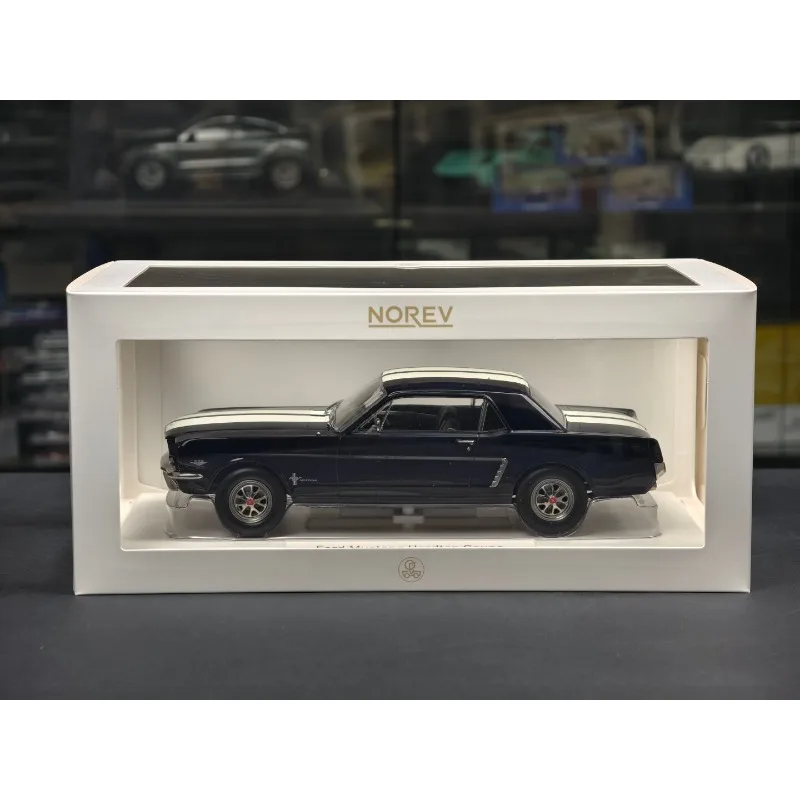 

Модель автомобиля Ford Mustang Coupe 1965 года, синего цвета, масштаб 1:18, Norev, литая под давлением, артикул 182805, из сплава.