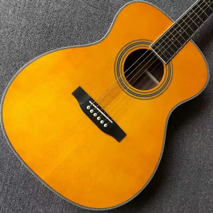 The 40 inch OM28 series is a solid wood profile with yellow glossy paint acoustic acoustic guitar