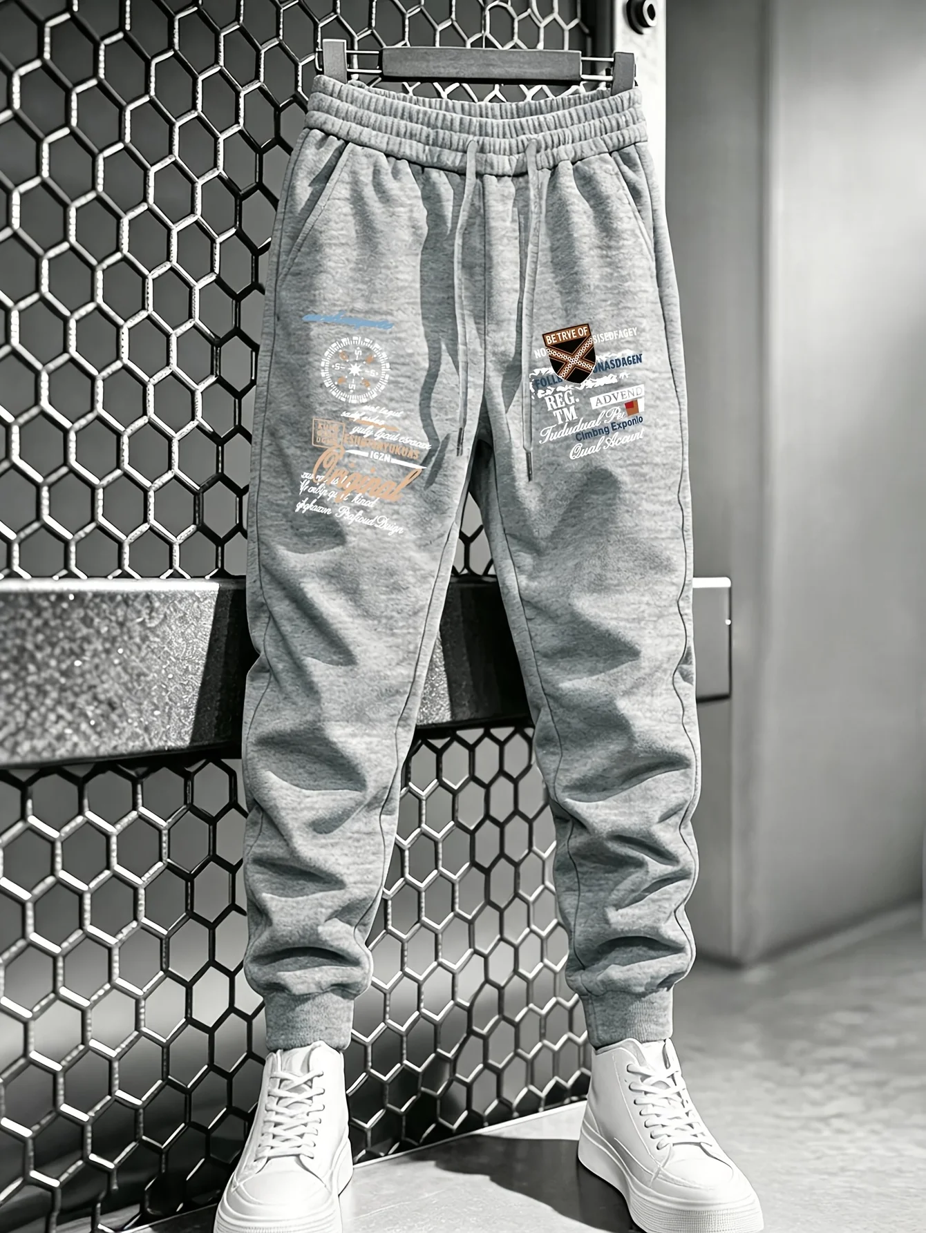 Outdoor‑theme‑hiphop vintage badge collage graphic print comfy dual‑leg sweatpants men hip hop sports jogger trousers
