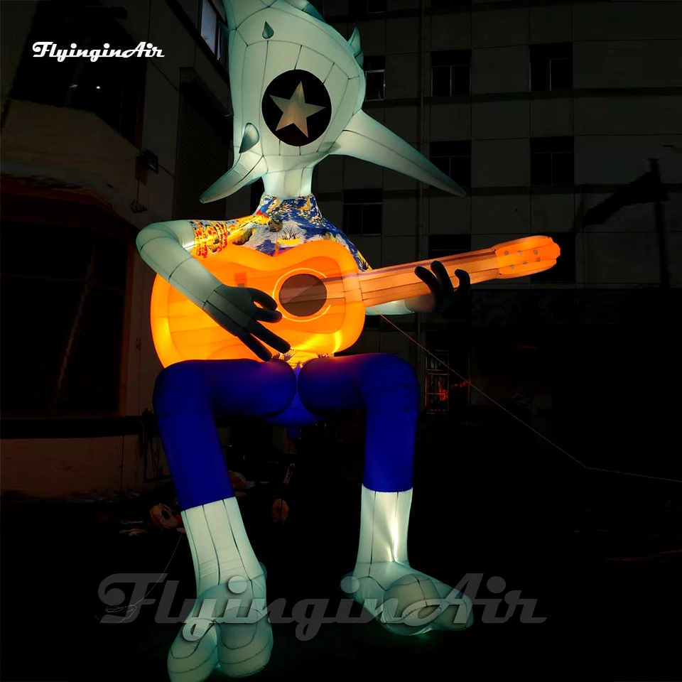 

Personalized Cartoon Figure Giant Blue Sitting Inflatable Alien Monster With A Guitar For Concert Stage Decoration