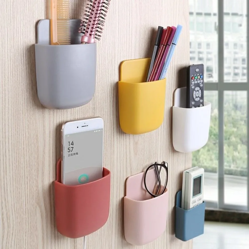 Mobile phone storage box without punching creative wall-mounted bedside TV air conditioner remote control storage rack