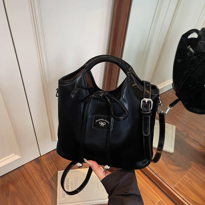 Premium sense simple hand bag women's Korean version fashion niche tide shoulder crossbody bucket bag