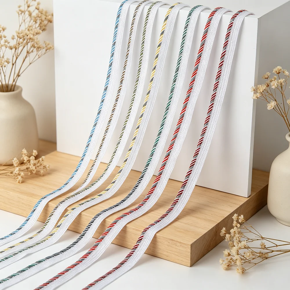 Sewing Thread In Textile - شريط زخرفي ملون بقاعدة بيضاء بطول